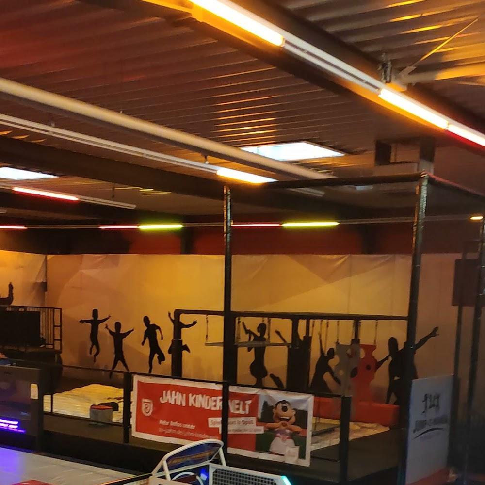 An indoor trampoline park with a